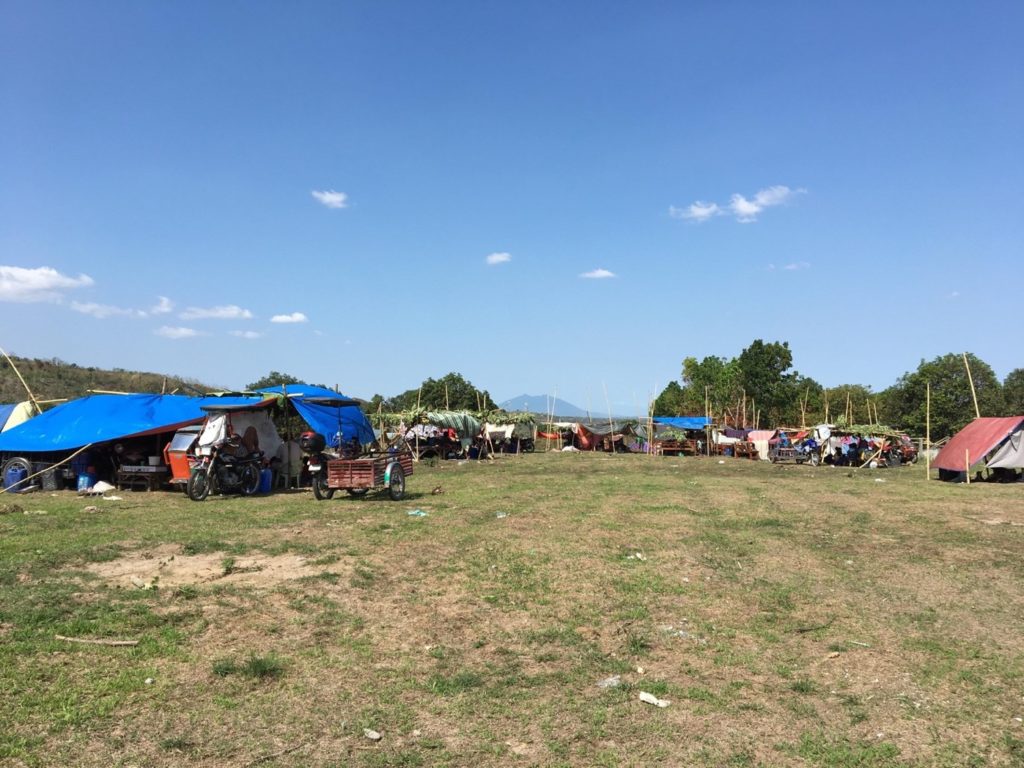 Photo 15. People prefer to sleep in tents while aftershocks rock the region (Marvin Natividad